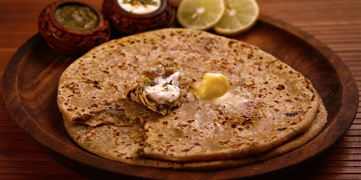 Stuffed paratha with white butter